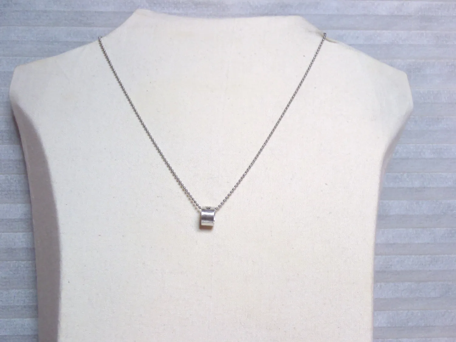 Personalized Pet memorial Necklace for dog or cat with stamped pawprint and name inside the charm